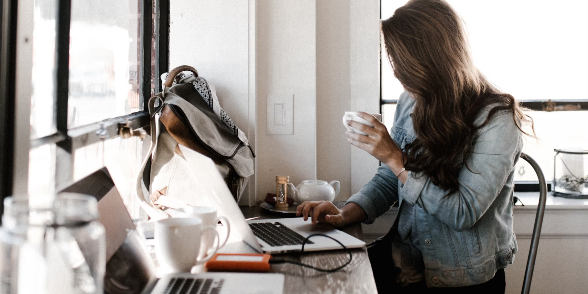 woman in a coffee shop working remotely