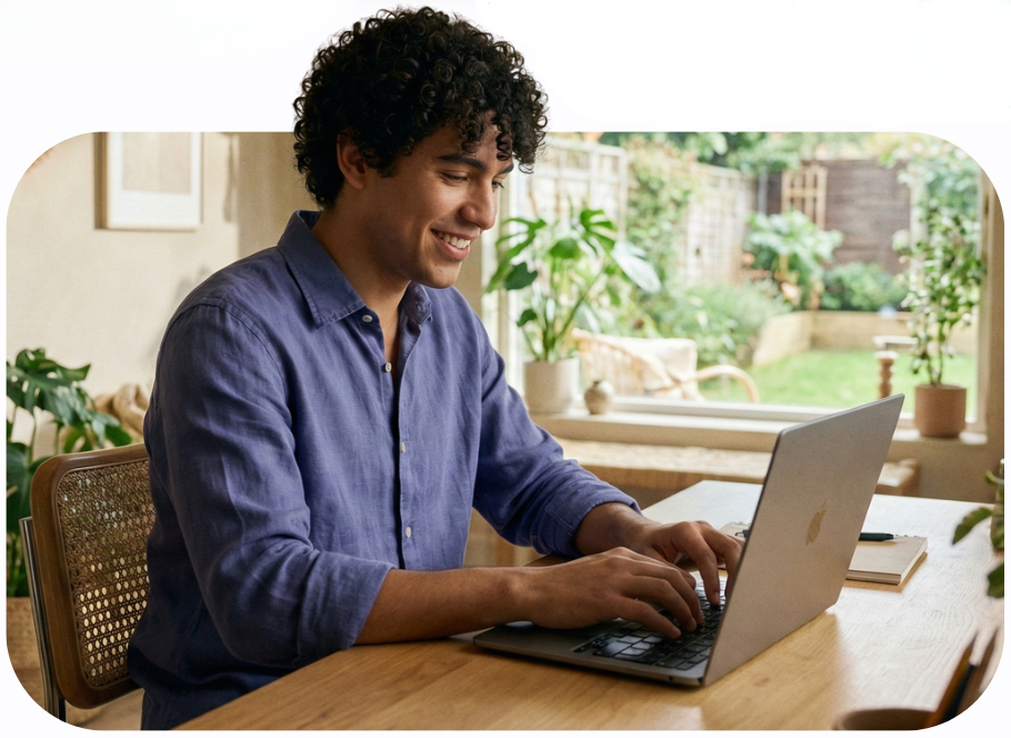 young male working in a home office, using staXscale (managed cloud hosting)